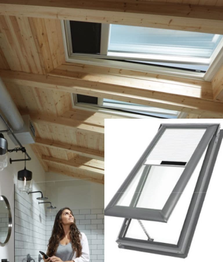 A woman gazes up at skylights on a wooden ceiling in a modern bathroom. Inset shows a closer view of an open roof window, highlighting its structure.