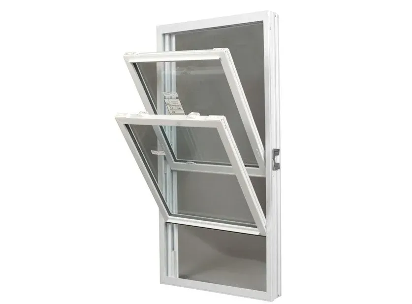 A white-framed double-hung window with the top pane tilted inward, showcasing its tilt-and-clean feature against a plain background.